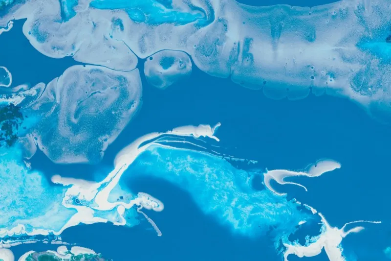 Abstract blue and white fluid art with swirling patterns