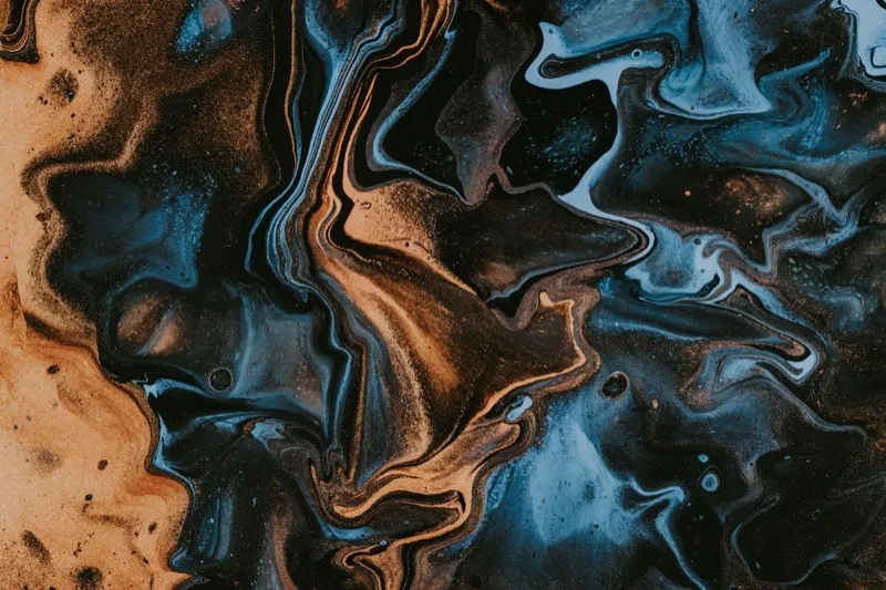 Abstract blue and brown fluid painting with gold tones