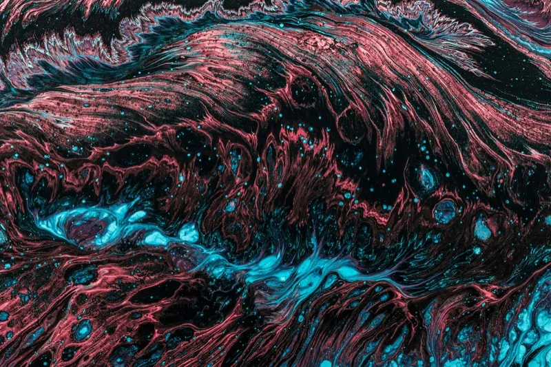 Abstract red and blue fluid painting with contrasting tones